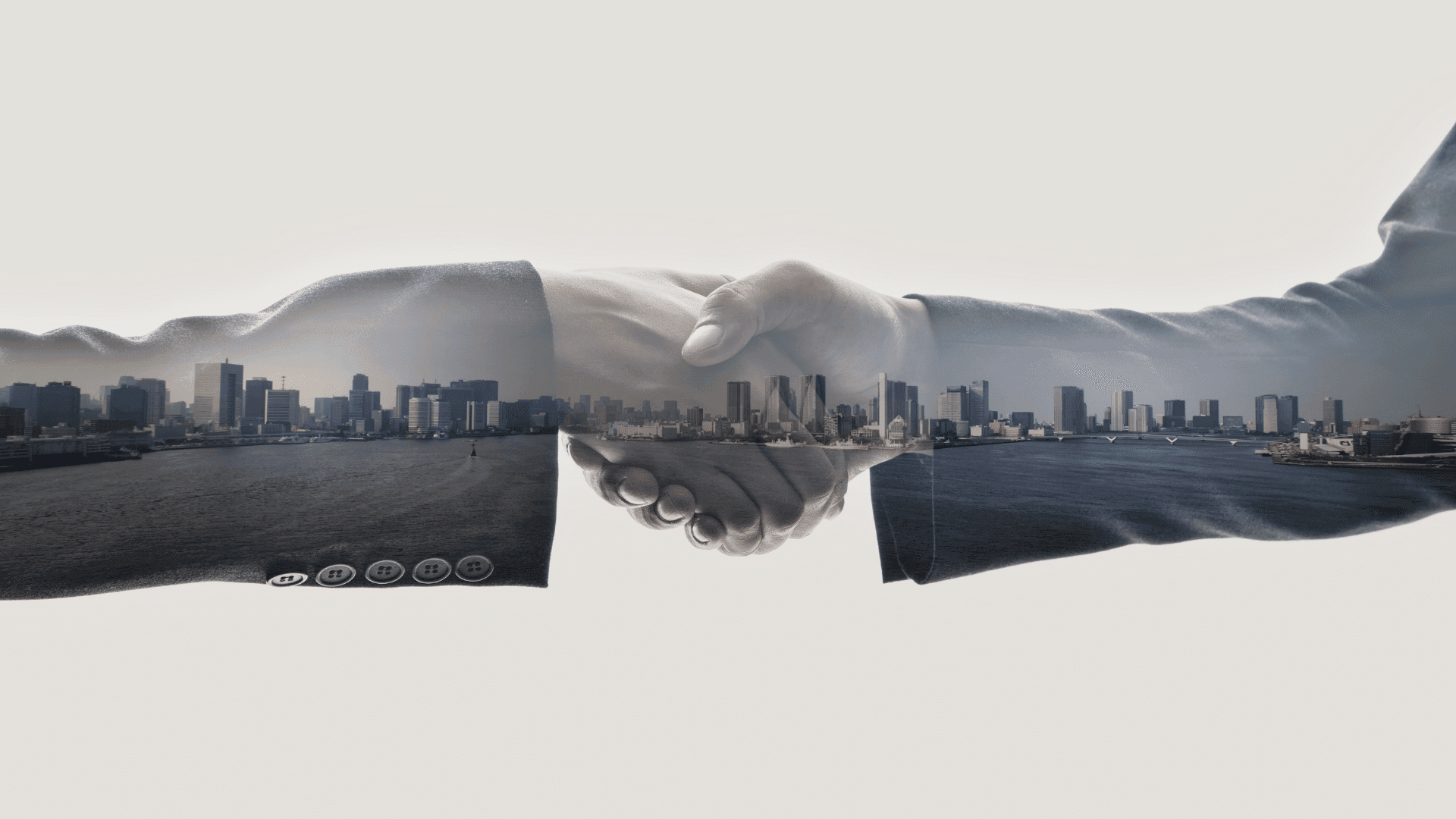 Handshake symbolising strategic property investment partnerships in Australia’s urban markets