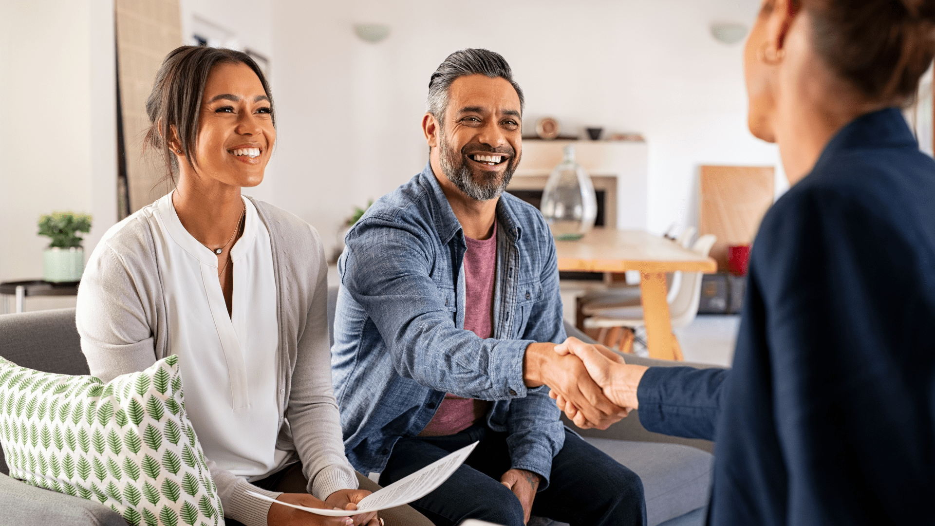 Happy couple meeting with a property investment advisor to begin their journey with PropVest